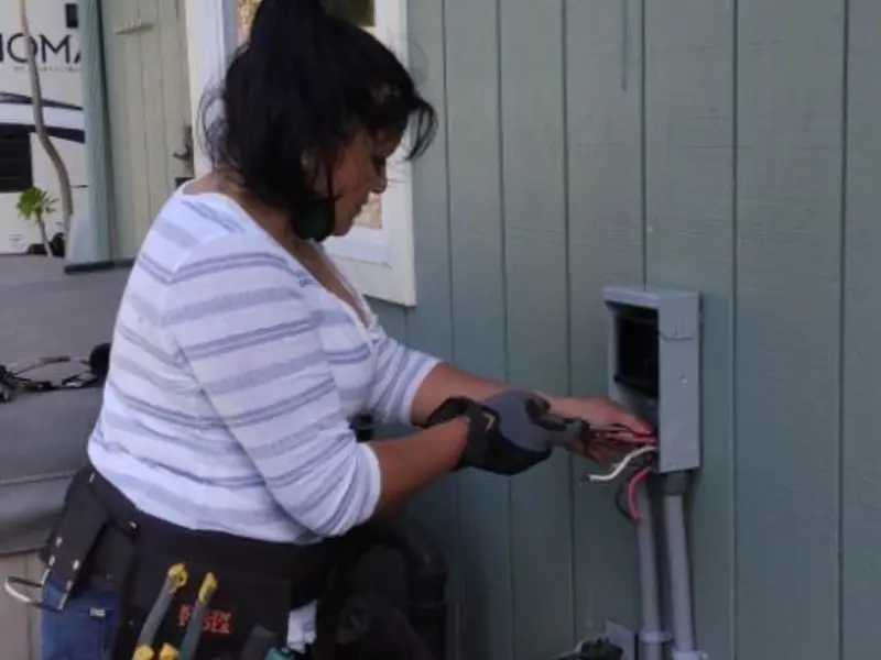Licensed electrician wiring an exterior subpanel in Fruitland